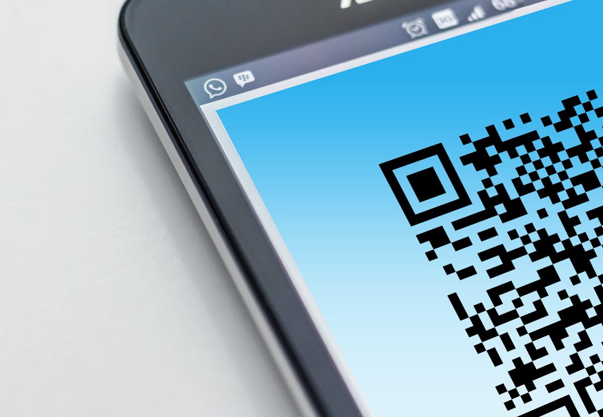 Smartphone displaying a QR code for digital event access